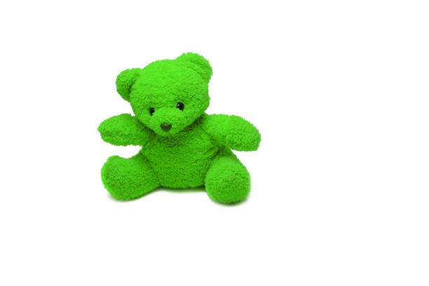 Smiling Teddy bear best friends toy for kids. Adorable Fluffy Brown Teddy Bear happy in green park. Happy fun friend fluffy cute toy doll sitting at garden. Stuffed Toy for kids Family childhood