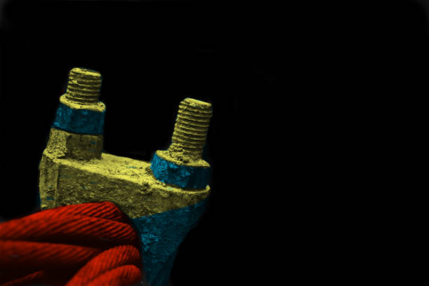 Isolated colourful screws with black background photo