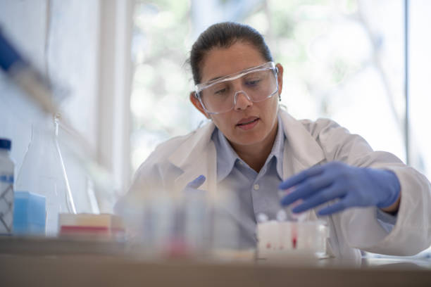 istock Latino microbiologist at work in the lab 1169769938