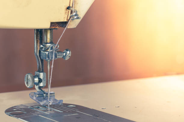 istock Closeup old sewing machine needle head detail 1169771301