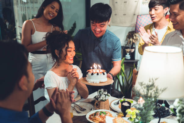 asian friends group celebrating at a birthday party she wishes to bless the birthday - birthday party adult women imagens e fotografias de stock