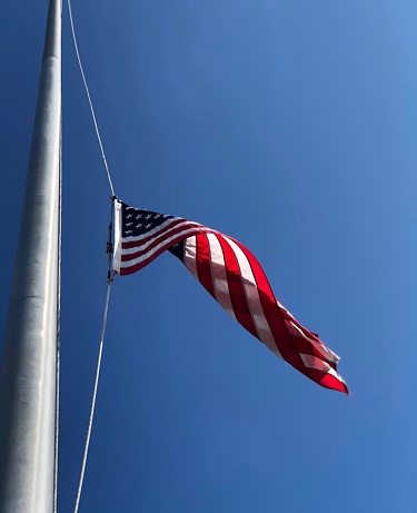 A very high half staffed American flag