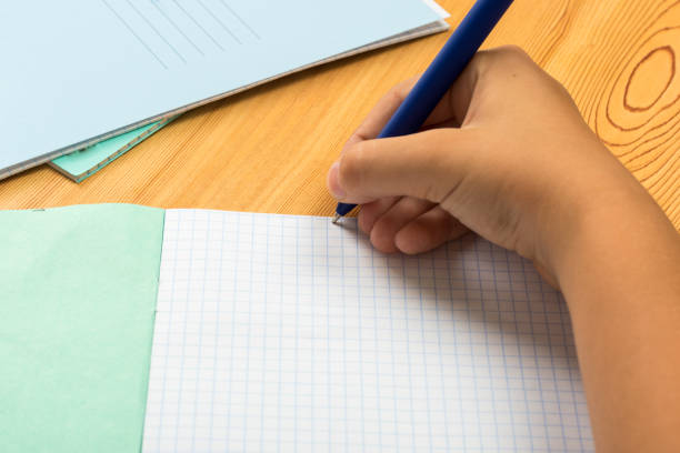 istock girl begins to write from scratch in a new notebook 1169772522