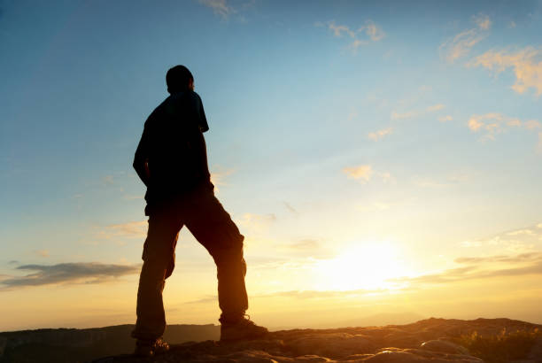 istock Man on top of mountain. 1169772974
