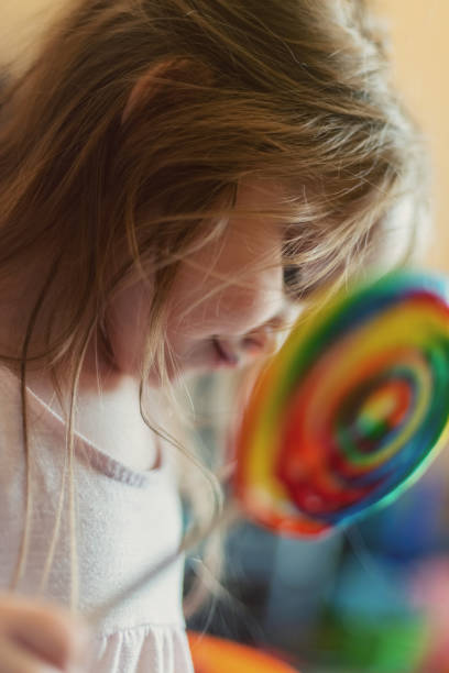 istock Girl Enjoys Lollipop 1169773057