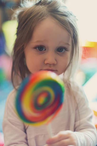 istock Girl Enjoys Lollipop 1169773077