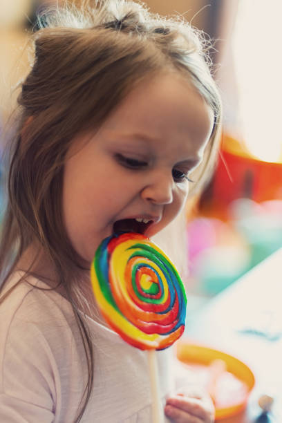 istock Girl Enjoys Lollipop 1169773135