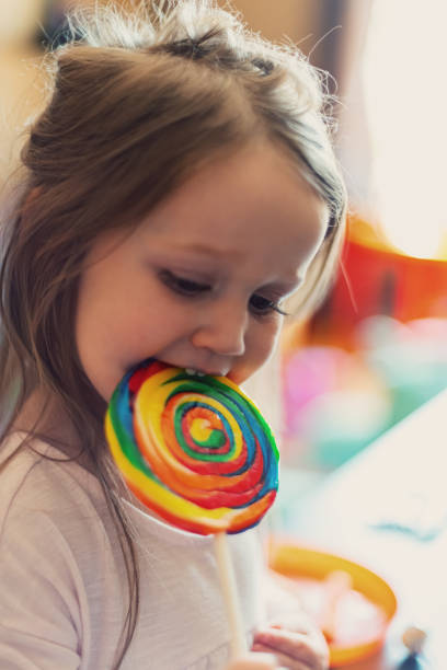 istock Girl Enjoys Lollipop 1169773899