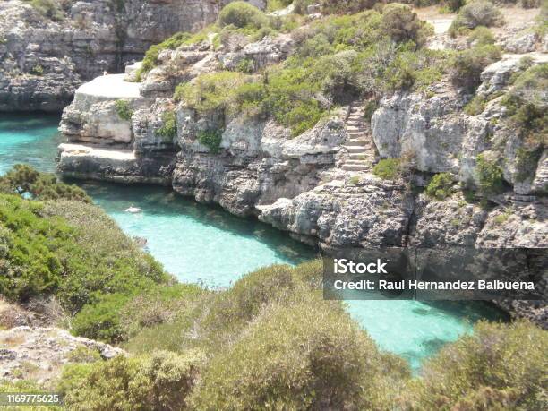 Beautiful Cala N Brush With Its Clear Waters Between Blue And Green In Citadel On The Island Of Menorca Stock Photo - Download Image Now