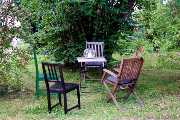 istock Three chairs in a garden for a picnic 1169776968