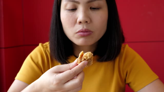 Woman eating junk food