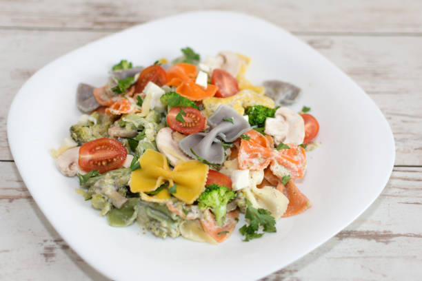 istock Italian colorful bow tie farfalle pasta with sauce. 1169780902