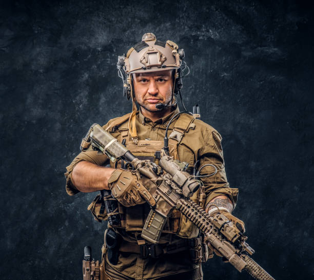 istock Elite unit, special forces soldier in camouflage uniform posing with assault rifle. 1169781447