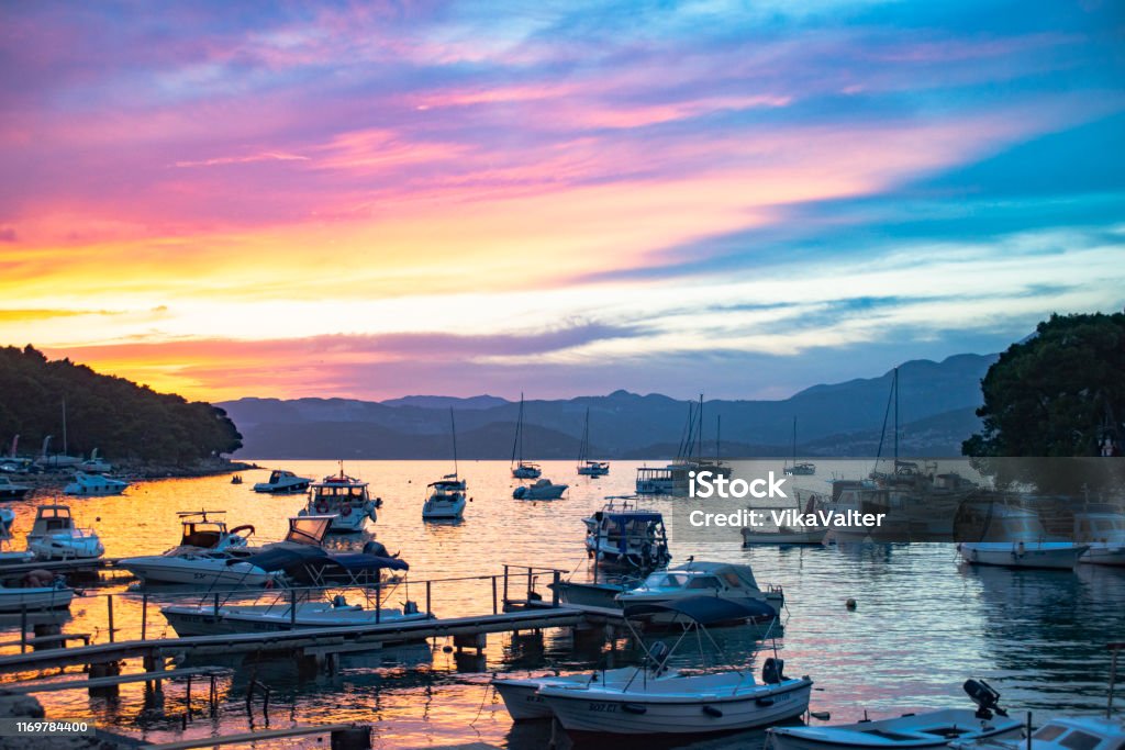 Sunset sky over the boats in the bay of Cavtat, Croatia Sunset sky over the bay of Cavtat, Croatia Cavtat Stock Photo