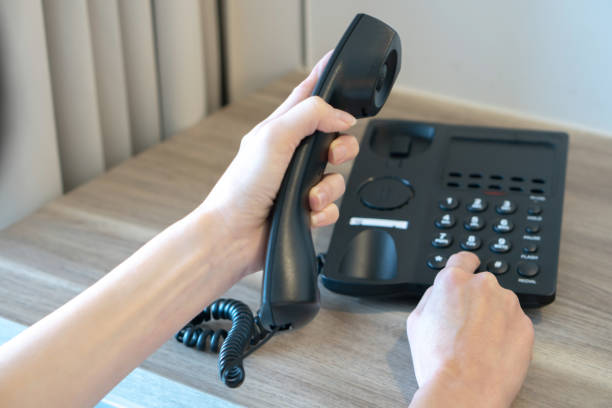 istock Female hand use telephone office 1169787523