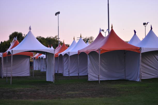 istock Empty Carnival orange and white Tents 1169787560