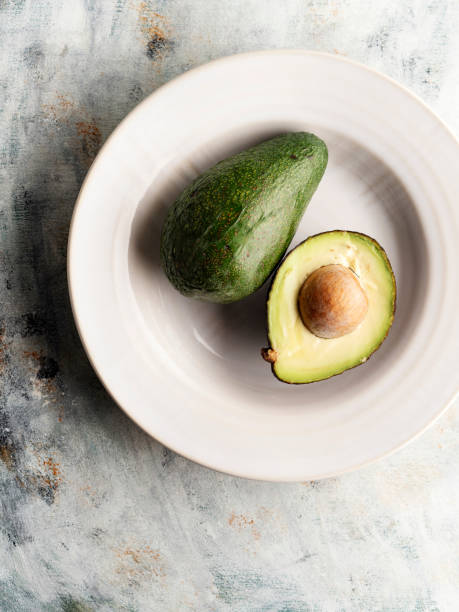 istock Fruit: Avocado,Ripe avocado cut in half Full,Fresh avocado 1169788538