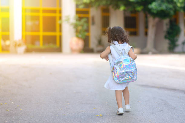 istock Girl At School Playground On First Day In September. 1169788657