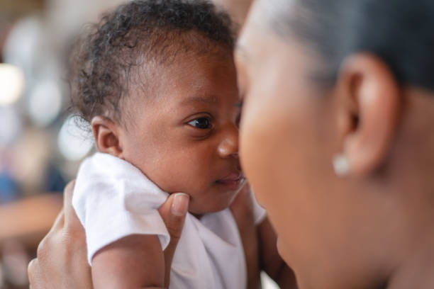 istock Hugging and interacting with a newborn 1169791369