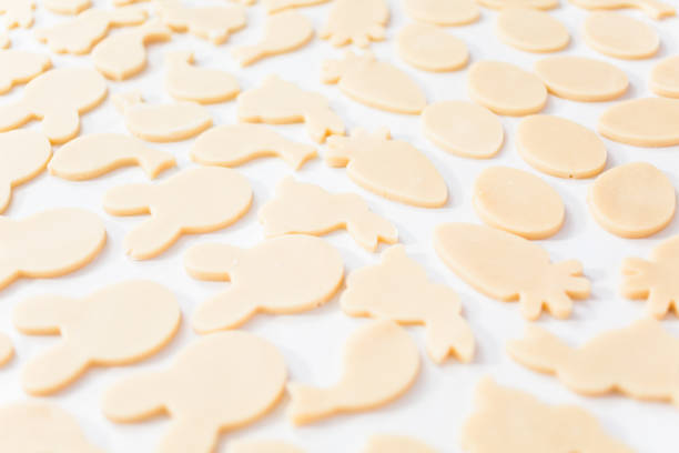 Unbaked Easter sugar cookies on a white table.