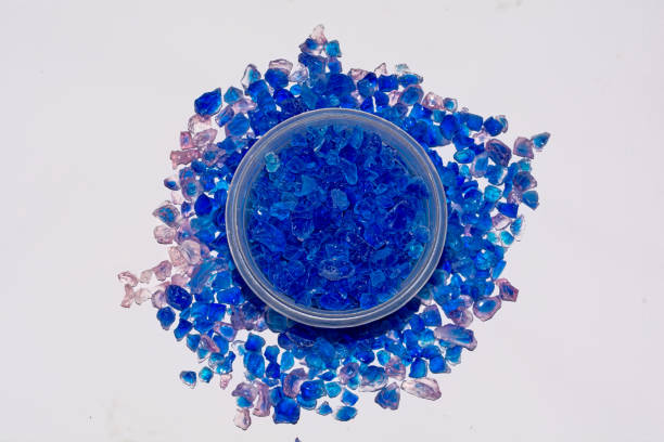 istock Silica gel crystal granules on white background 1169796119