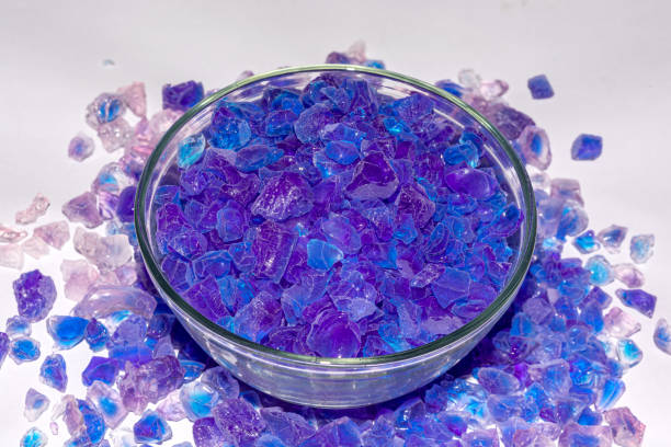 istock Silica gel crystal granules on white background. 1169796128