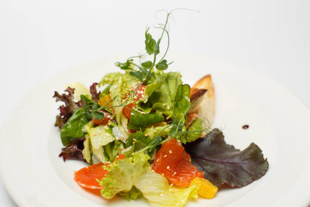 istock vegetable salad with salmon and croutons 1169796478