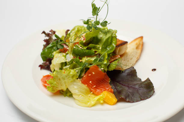 istock vegetable salad with salmon and croutons 1169797030