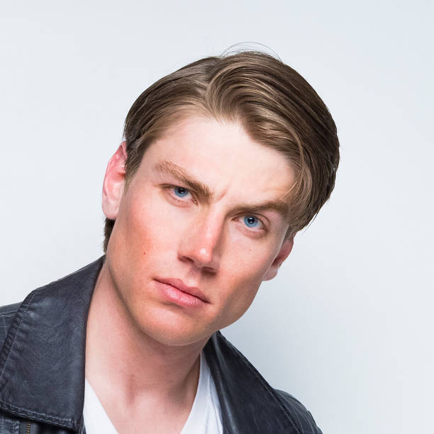 istock Good looking man wearing a leather jacket 1169800492