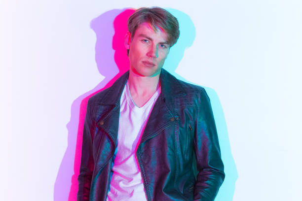 istock Handsome male model with color shadows 1169800854