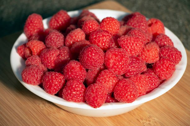 istock Fresh Raspberries in a Bowl Close Up 1169802280