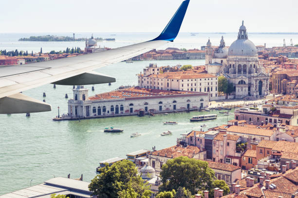 istock Plane flies above Venice, Italy 1169804761