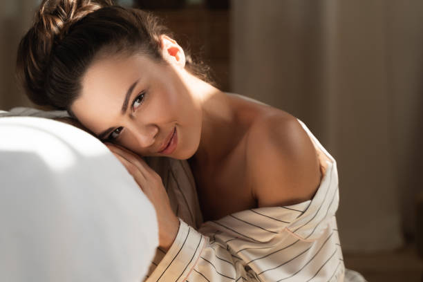 istock Attractive lady resting her head on hands and smiling 1169805062