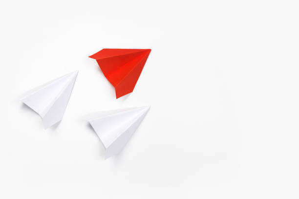 istock Red paper plane are different from others on white background. Think different. Business for innovative, solution concepts 1169808499