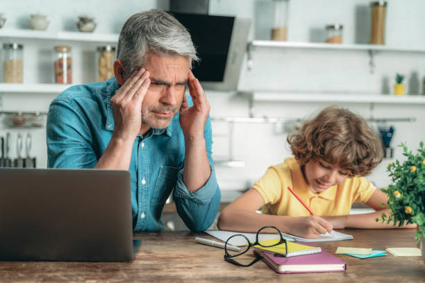 istock Father helping with school homework his little son 1169808853