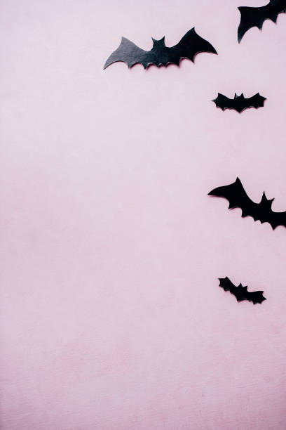 istock Halloween background with paper bats decorations 1169810203