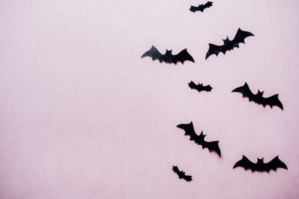 istock Halloween background with paper bats decorations 1169810208