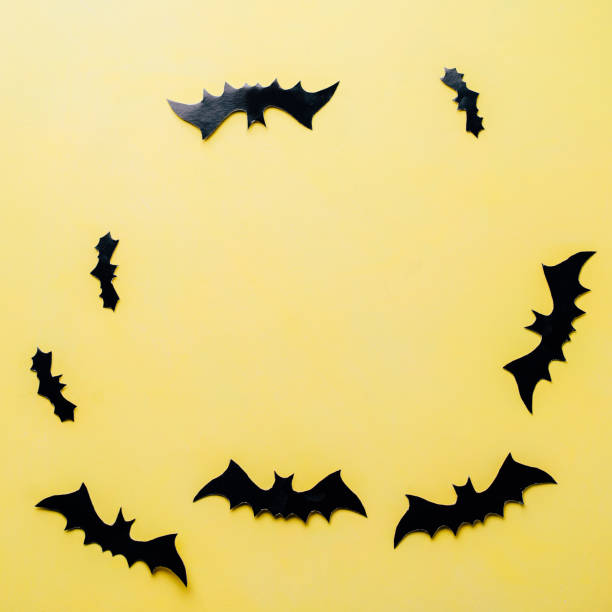 istock Halloween background with paper bats decorations 1169810209
