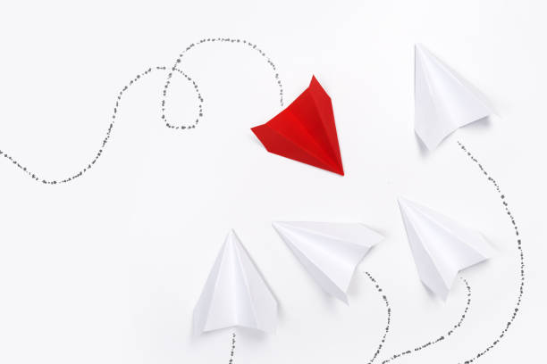 istock Red paper plane are different from others on white background. Think different. Business for innovative, solution concepts 1169810977