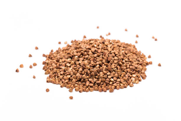 istock raw buckwheat isolated on white background. 1169810983