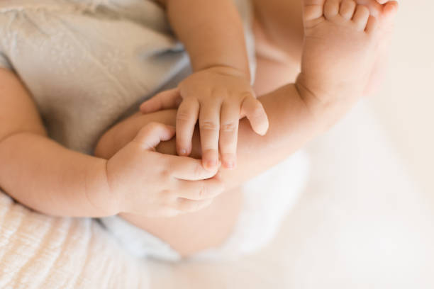 istock Baby Girl Hands 1169813359
