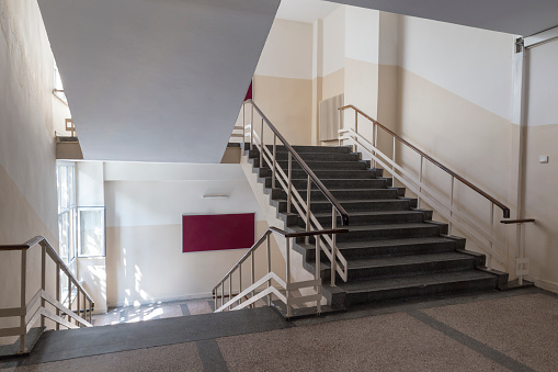 Empty stairs, window and billboard