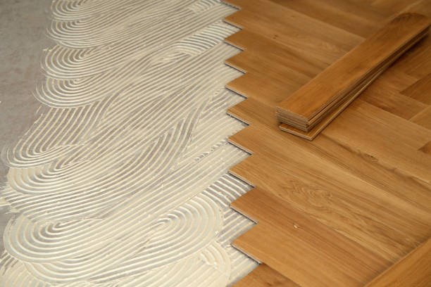 istock Construction in a renovated room installation of parquet 1169819872