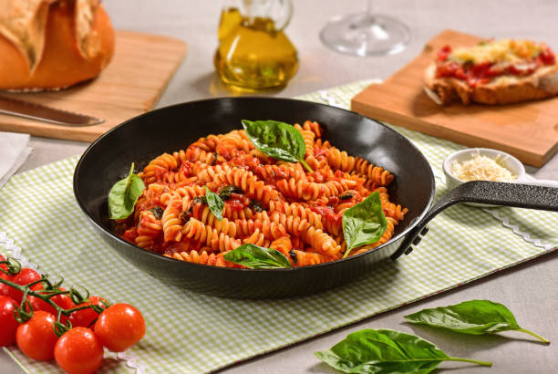 istock Traditional Italian pasta on black rustic pan 1169820866