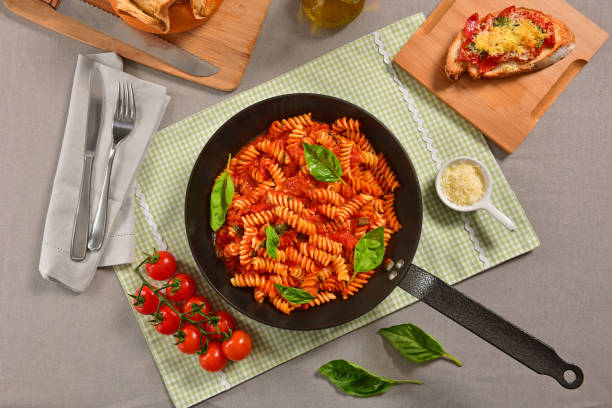 istock Traditional Italian pasta on black rustic pan 1169821032