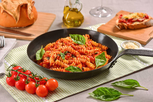istock Traditional Italian pasta on black rustic pan 1169821740
