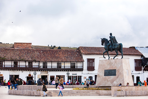 Tunja, Colombia - August, 2019: Tourists and locals at the beautiful Bolivar Square in Tunja city