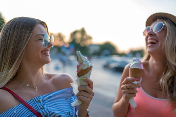 istock Friends eating ice cream 1169827106