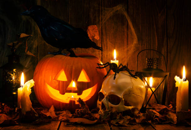 istock Halloween Jack-o-Lantern Pumpkins on rustic wooden background 1169832773