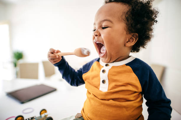 istock Toddler eating yogurt 1169834761